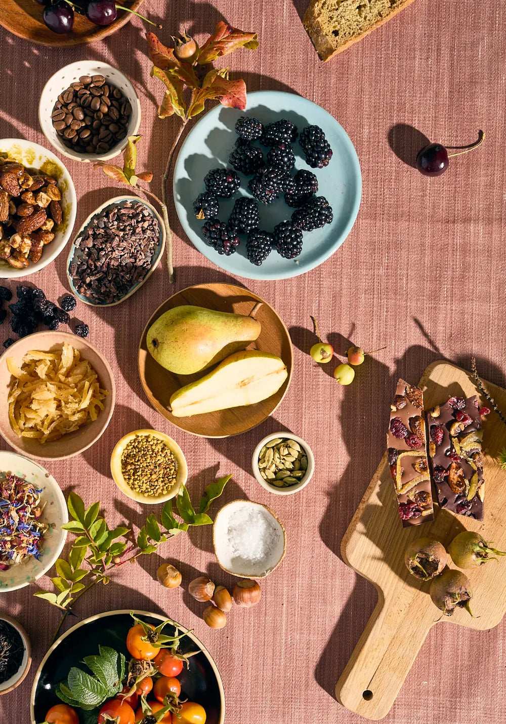 Ingredients laid out on a table beside broken chocolate