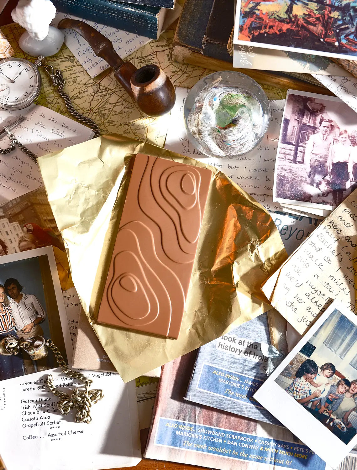 A Tasting Club bar wrapped in gold paper among keepsakes