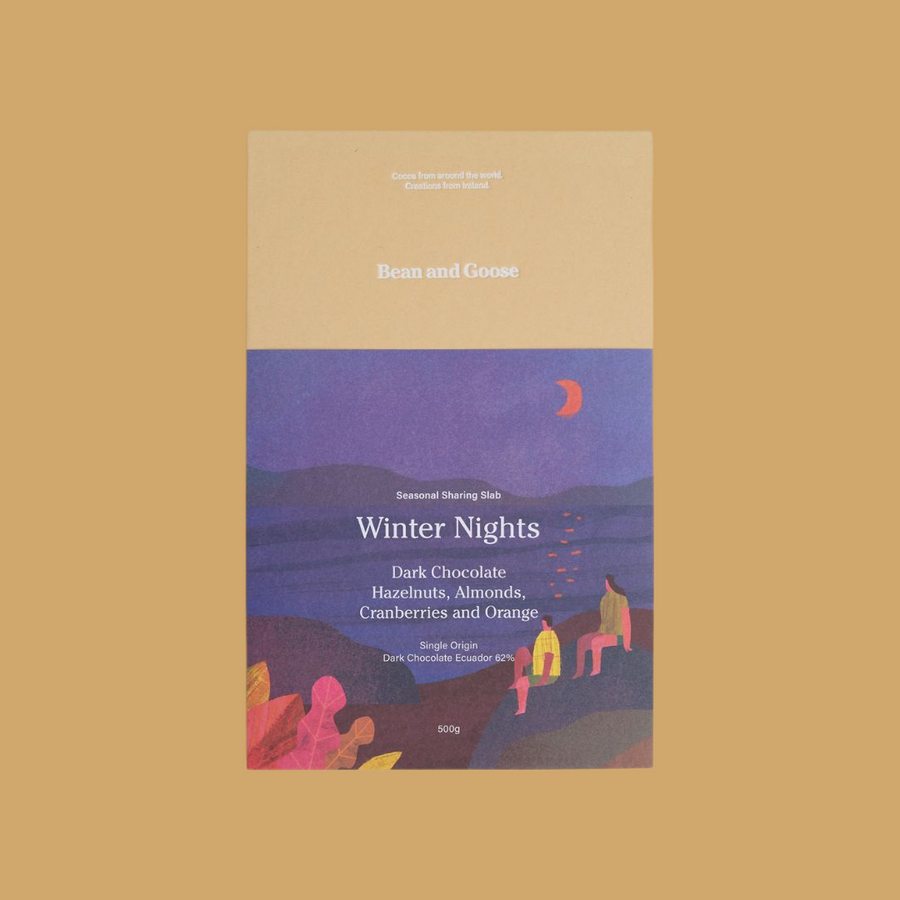 Packaging of Bean and Goose dark chocolate slab titled 'Winter Nights'. The packaging features an illustration of a winter scene with a moon and warm-toned sky.