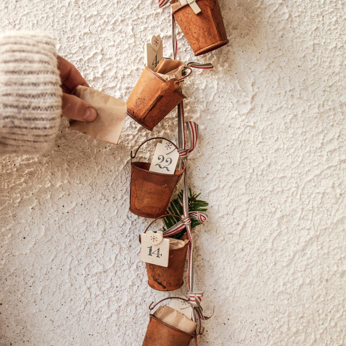 Close-up of numbered advent buckets holding Bean and Goose chocolate islands, made in Ireland.