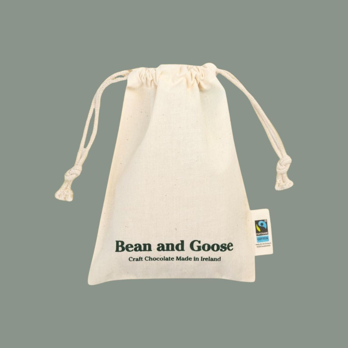 Beige drawstring bag with 'Bean and Goose' branding on a gray background