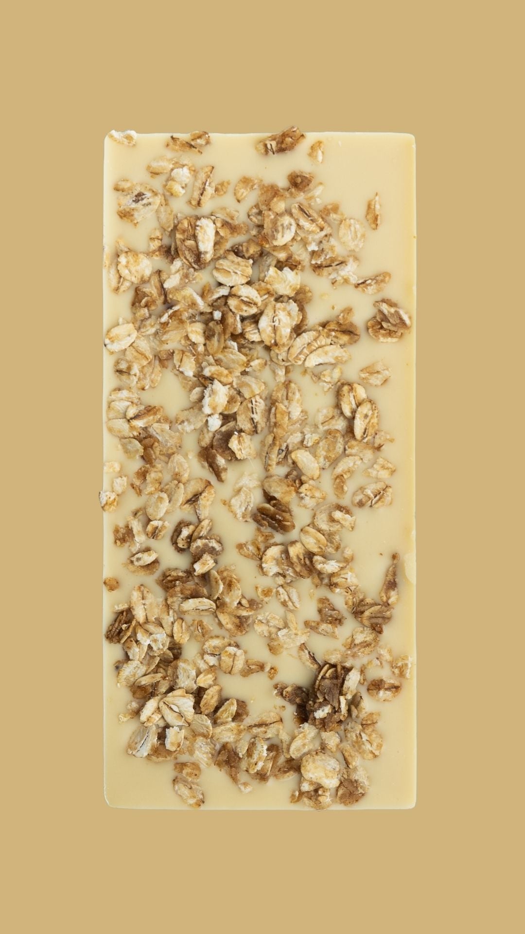 Bean and Goose Bar of white chocolate with toasted oats on a beige background