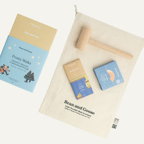 Bean and Goose chocolate packaging and a wooden hammer on a white background
