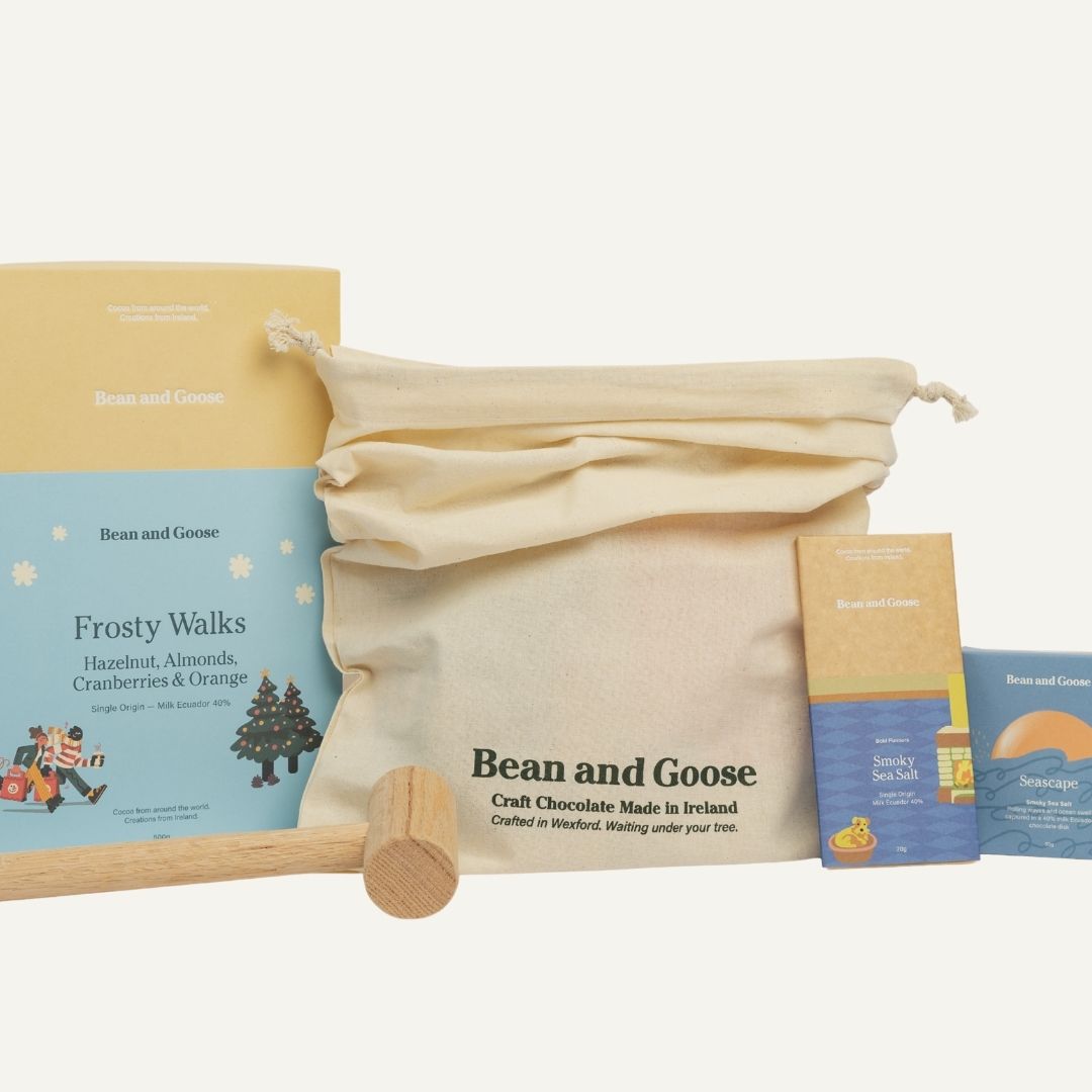 Bean and Goose craft chocolate packaging with a wooden hammer on a white background