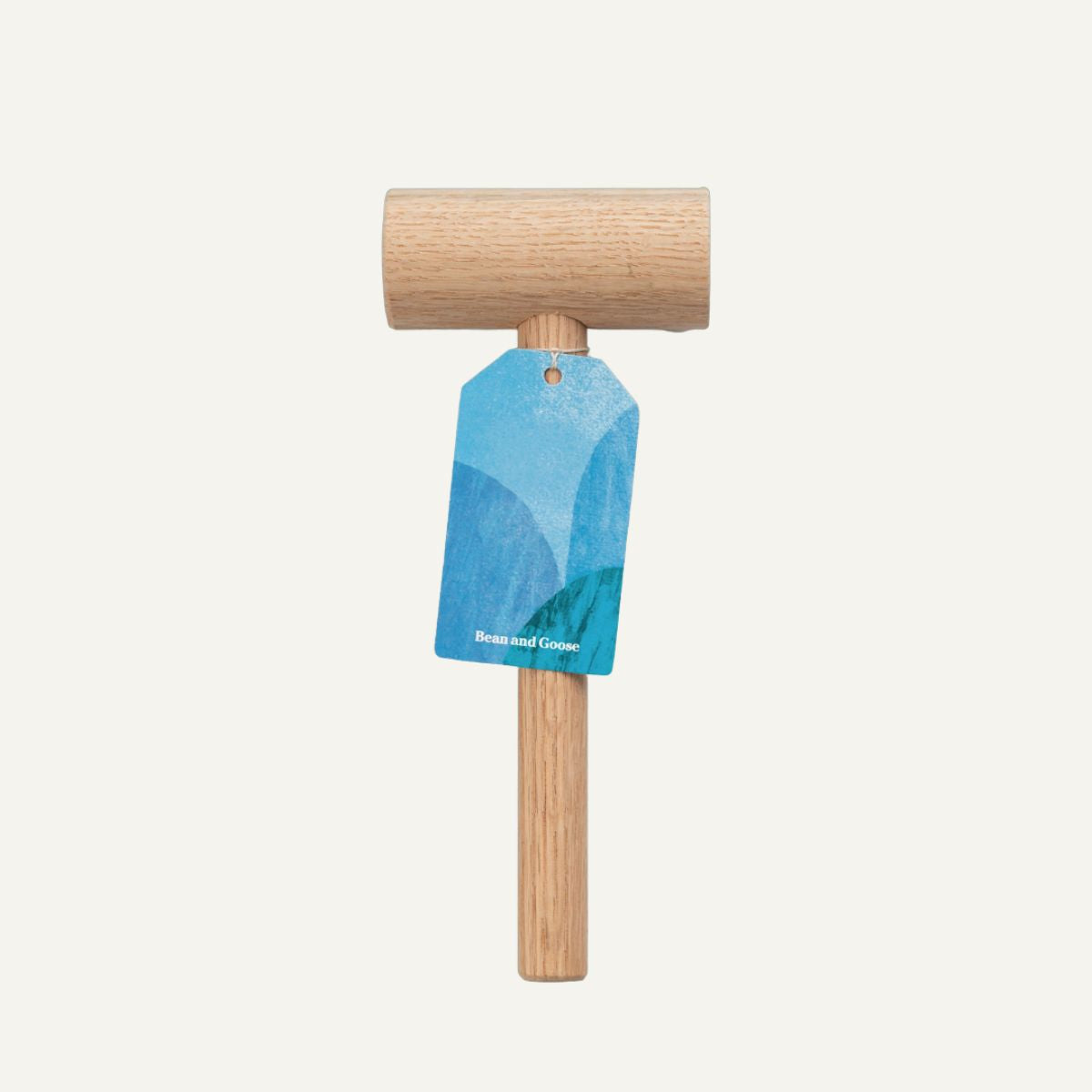 Wooden mallet with a blue tag on a white background