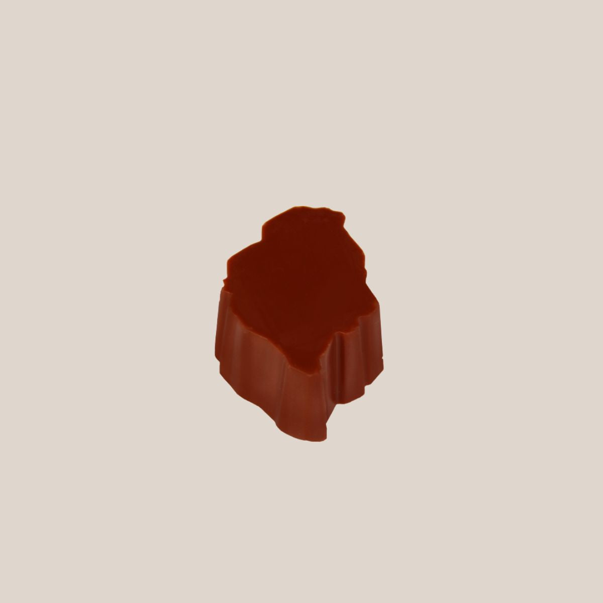 Single milk chocolate island from Bean and Goose Advent Calendar on cream background