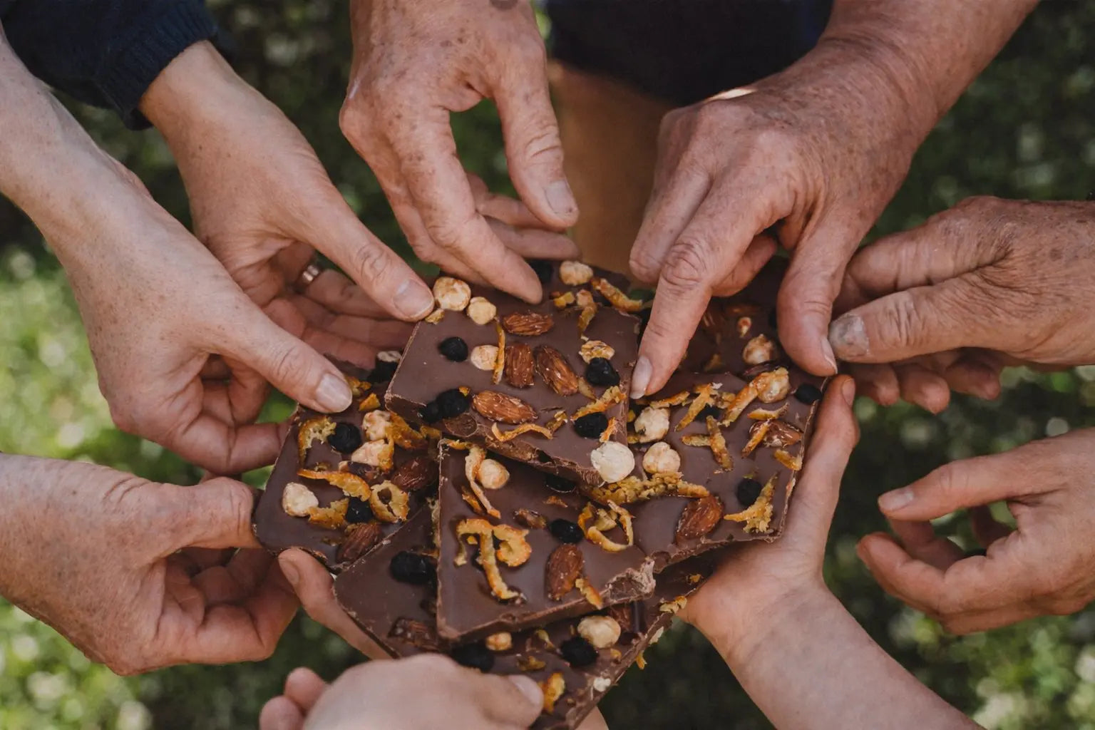 Hands sharing handcrafted Irish chocolate, made in Wexford