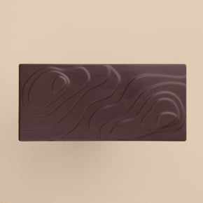 Bean and Goose Dark chocolate bar with their patent landscape bar design on a beige background