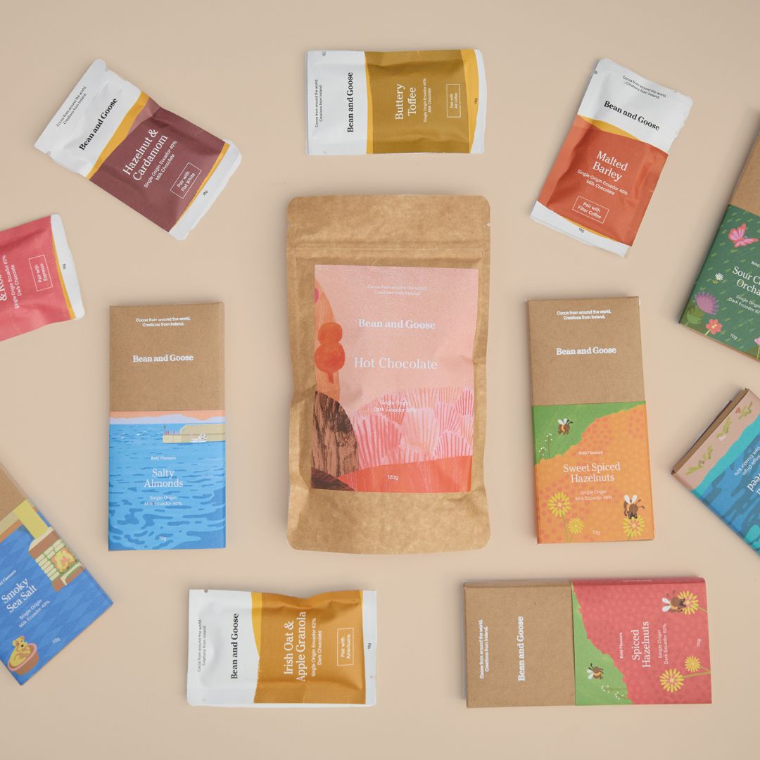 Bean and Goose all bar bundle assortment of chocolate bars, cafe bars and hot chocolate and packaging, with an emphasis on unique flavors and gift bundling.