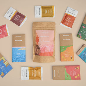 Bean and Goose all bar bundle assortment of chocolate bars, cafe bars and hot chocolate and packaging, with an emphasis on unique flavors and gift bundling.