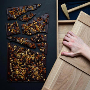 1.5kg slab of chocolate in a handmade irish oak box with an oak hammer with a brass head